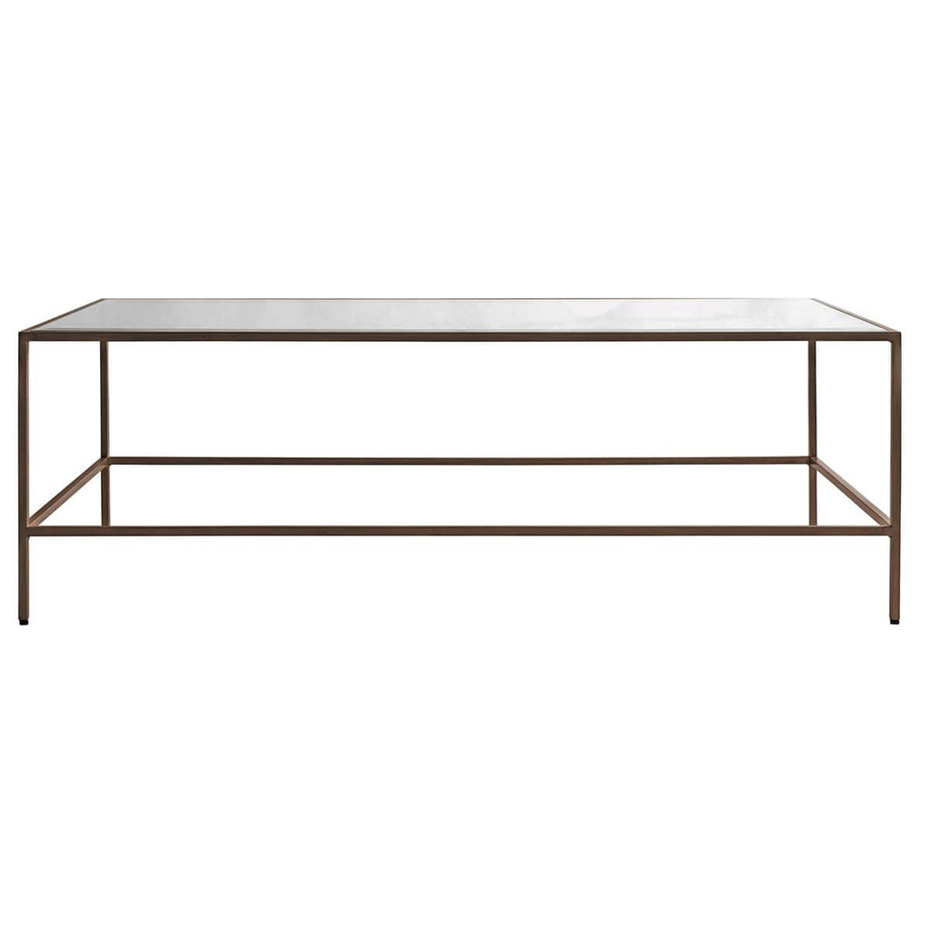 Table basse avec plateau en verre biseauté et piètement en métal bronze