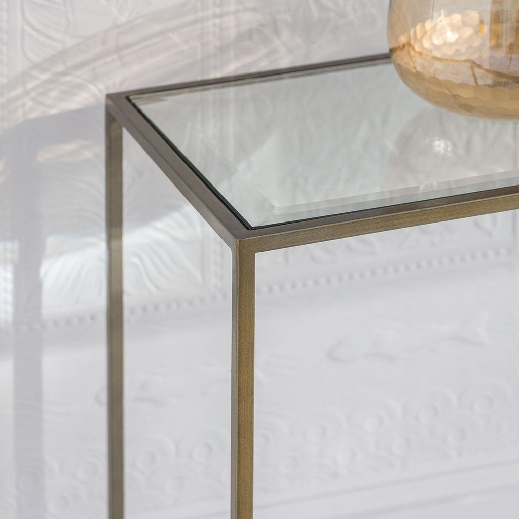 Console en métal bronze antique avec plateau en verre biseauté
