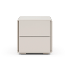 Table de chevet incurvée beige mat au design minimaliste